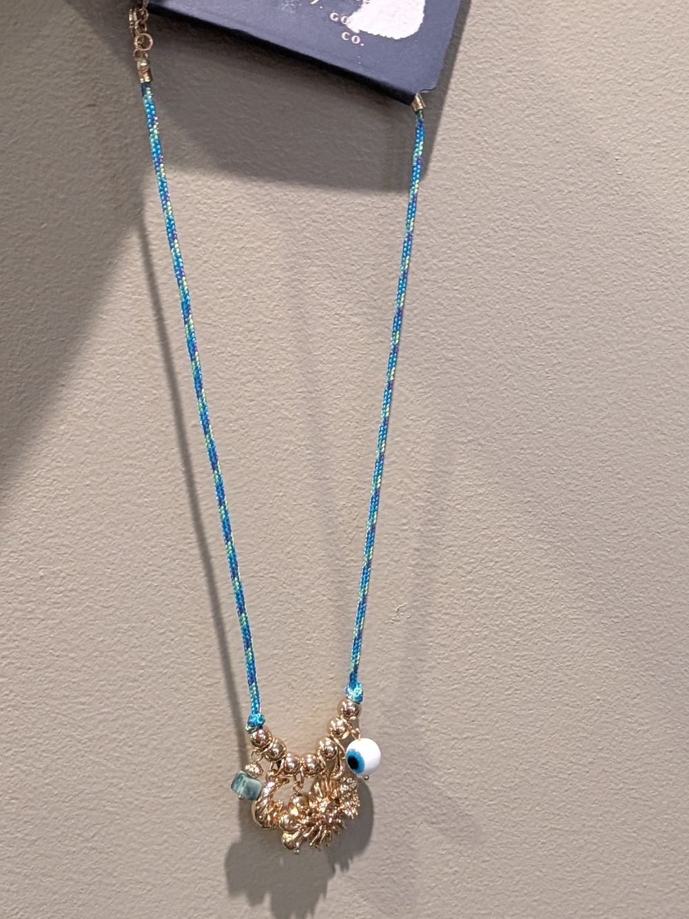 Universal Thread Gold Charm Necklace with Blue Cord and Evil Eye